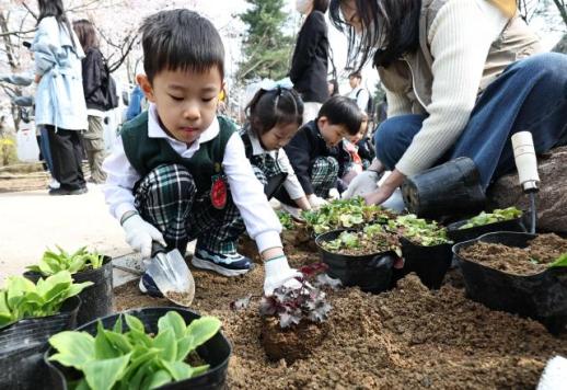 Learning to plant green on Arbor Day