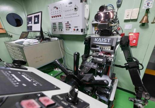 Navy tests humanoid robot at ships wheel in first crew experiment