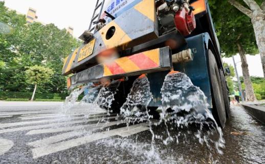 Water trucks cool down roads amid heat wave