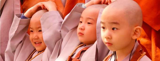 Young boys ordained as Buddhist novices