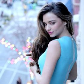 After taking down a photo of her in strappy Chanel bikini top, Miranda Kerr posts fully clothed picture