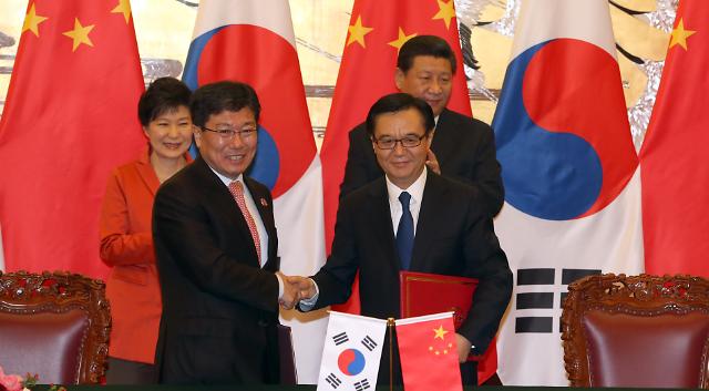 中韩FTA正式签署 两年半谈判修成正果