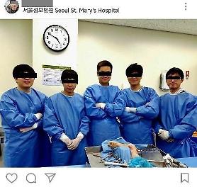 Doctors punished for posting certification picture on cadaver