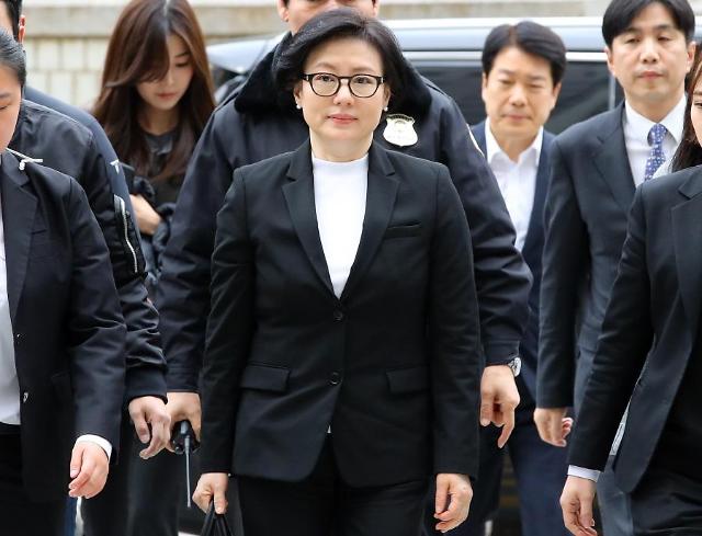 Lotte Group founder, two sons and wife appear in court for trial 