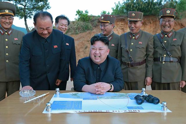 N. Korea leader hails test of new missile capable of carrying nuclear warhead  