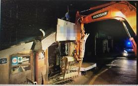 Schizophrenics midnight excavator rampage tears village apart