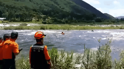 Firefighters rescue father and two children from deadly river current
