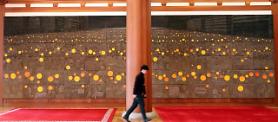 [PHOTO] Giant painting depicting candle-lit rallies on display in presidential house