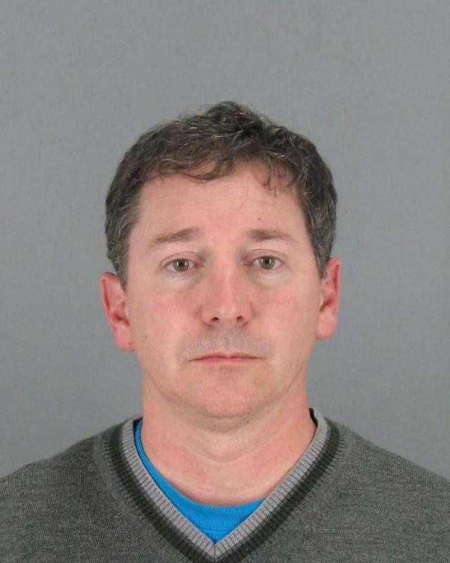 Californian business exec arrested at airport when wife notifies authorities after fining thousands of child pornographies in computer 