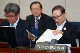 Jailed ex-president Lee asserts innocence at first court hearing