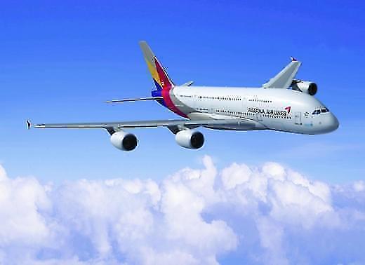 Asiana reduces international flights to put troubled system back in shape