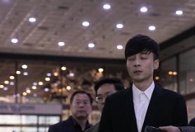 Singer Roy Kim appears for police questioning