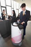 KT commercializes AI concierge robot at Seoul hotel to provide convenient service