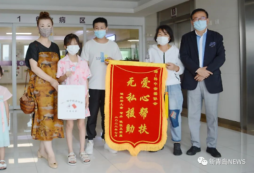 韩中亲善协会中国分会为两名中国先天性心脏病儿童捐款