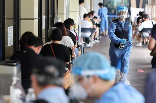 暑期人流量增加 韩防疫部门上调本轮疫情拐点至20万例