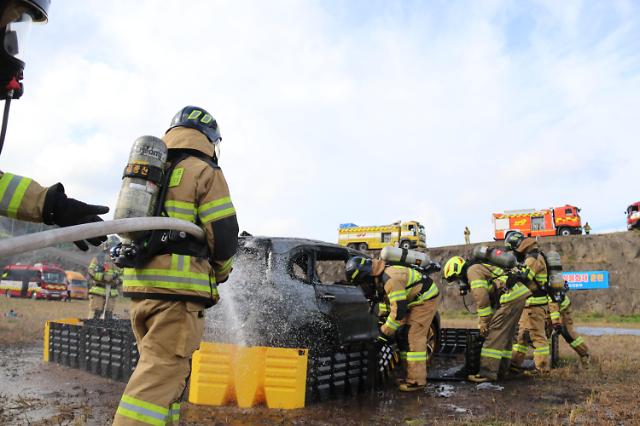 Firefighters test various tactics against EV battery fire through simulated drill