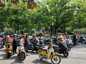 Food deliverymen hold rally in Seoul demanding better work environment