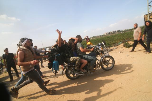 FILE - Palestinians transport a captured Israeli civilian center from Kfar Azza kibbutz into the Gaza Strip on Saturday Oct 7 2023 The militant Hamas rulers of the Gaza Strip carried out an unprecedented multi-front attack on Israel at daybreak Saturday firing thousands of rockets as dozens of Hamas fighters infiltrated the heavily fortified border in several locations by air land and sea and catching the country off-guard on a major holiday AP PhotoHatem Ali File FILE2023-10-09 060822
저작권자 ⓒ 1980-2023 ㈜연합뉴스 무단 전재 재배포 금지Copyright 2023 The Associated Press All rights reserved