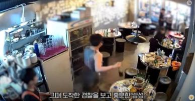 칼 내놔 전신 문신男, 나체로 난동 부리다 테이저건 맞고 쿵