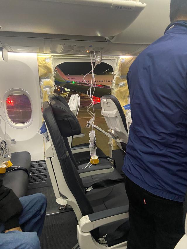Passenger oxygen masks hang from the roof next to a missing window and a portion of a side wall of an Alaska Airlines Flight 1282 which had been bound for Ontario California and suffered depressurization soon after departing in Portland Oregon US January 5 2024 in this picture obtained from social media 