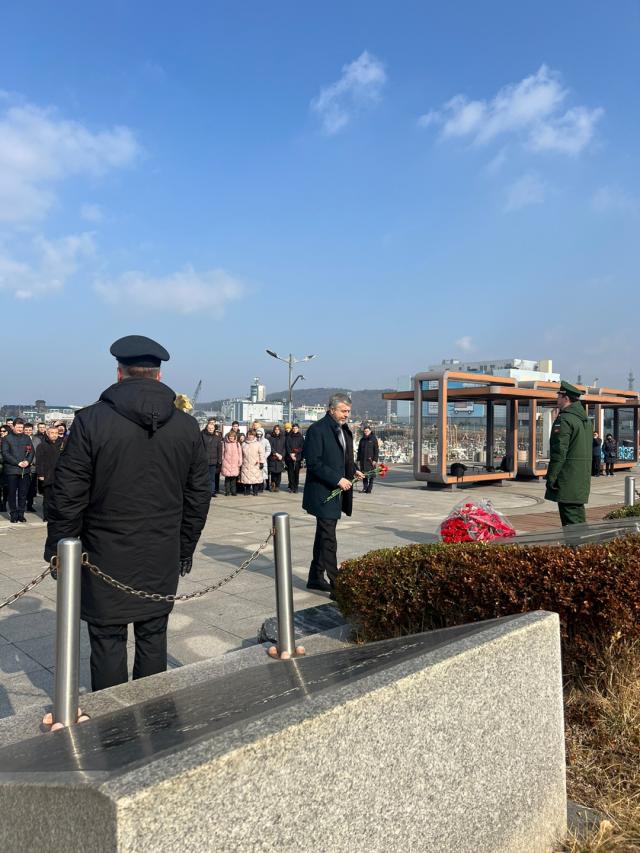 Russian Ambassador to the Republic of Korea Georgy Zinoviev is conducting a floral tribute during a memorial event held at the St Petersburg Square in Incheons Chemulpo harbor on February 9 2024  Courtesy of the Russian Embassy in the Republic of Korea