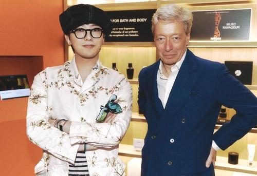 G-Dragon left with perfume brand Editions de Parfums Frederic Malles founder Frederic Malle Courtesy of Galaxy Corporation