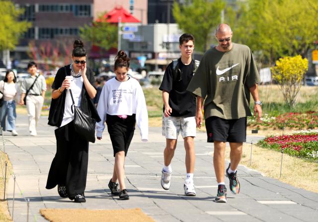 Foreign visitors stroll at Songhyeon Green Plaza in central Seoul on April 12 2024 AJU PRESS Han Jun-gu