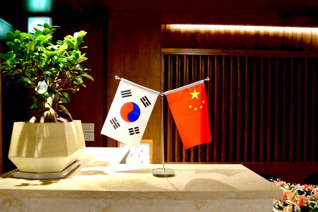 The national flags of South Korea and China displayed at the entrance of a hall where the Panda Cup writing contests opening ceremony took place Thursday AJU PRESS Han Jun-gu