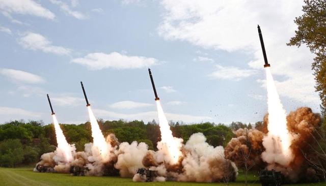 A photo released by the official North Korean Central News Agency KCNA on April 23 2024 shows missiles launched during a simulated nuclear counterattack drill at an undisclosed location in North Korea the previous day EPA-Yonhap