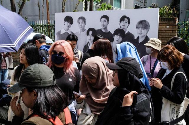 Fans wait to visit a pop-up store that will be open until May 12 of Korean K-pop sensation BTS entitled Monochrome in Seoul on April 26 2024 AP-Yonhap