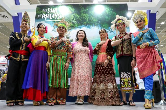 A visitor takes a photo at The ‘39th Seoul International Travel Fair’ at COEX in Seoul on May 9 2024 AJU PRESS Kim Dong-woo