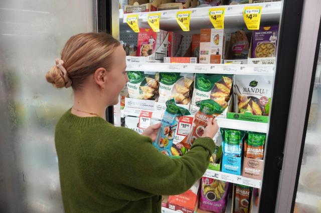 
A consumer is looking at CJ CheilJedangs new Korean food product in a Woolworths supermarket Courtesy of CJ CheilJedang
