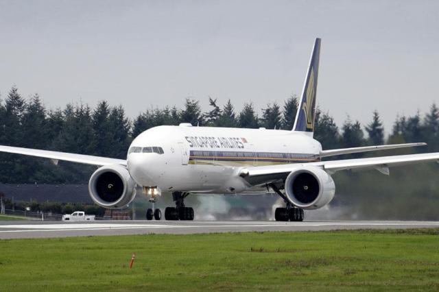 A Singapore Airlines Boeing 777-312ER readies to take off from Paine Field in Everett Washington on Sept 17 2013 Singapore Airlines said on May 21 2024 a person died aboard and others were injured when a London-Singapore flight encountered severe turbulence AP-Yonhap