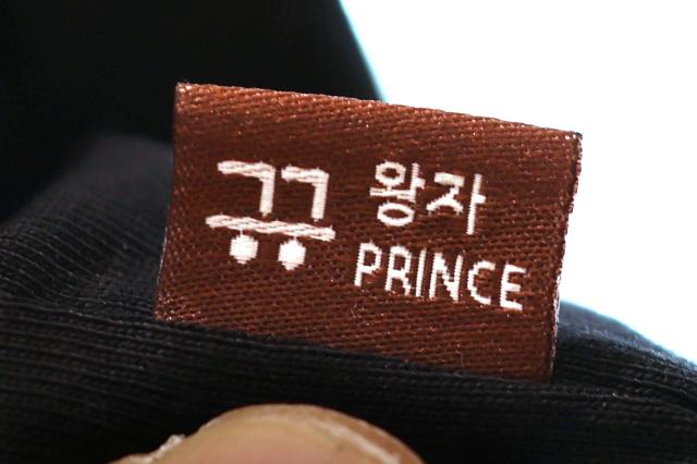 A garment tag of the North Face Hangeul collection T-shirt says Prince at their flagship store in Seoul Korea on May 24 2024 Photo courtesy Hyungwon Kang 