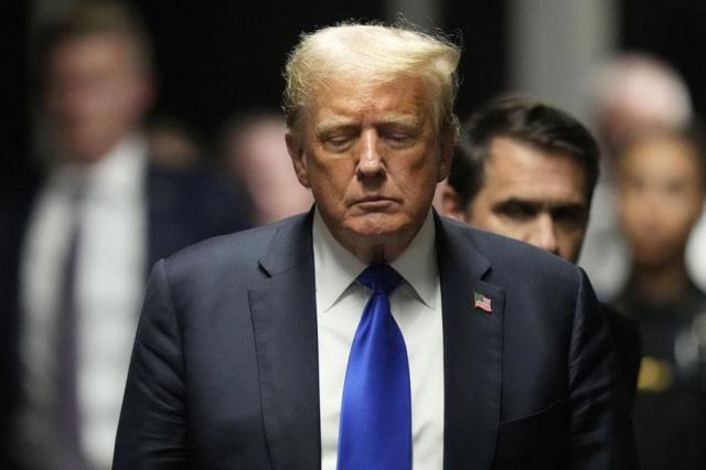 Former President Donald Trump walks to make comments to members of the media after a jury convicted him of felony crimes for falsifying business records in a scheme to illegally influence the 2016 election at Manhattan Criminal Court in New York on May 30 2024 AP-Yonhap
