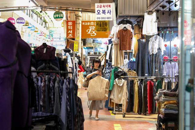 A citizen walks pass by a shop at a traditional market in Jongno-gu Seoul June 4 2024 AJU PRESS Kim Dong-woo