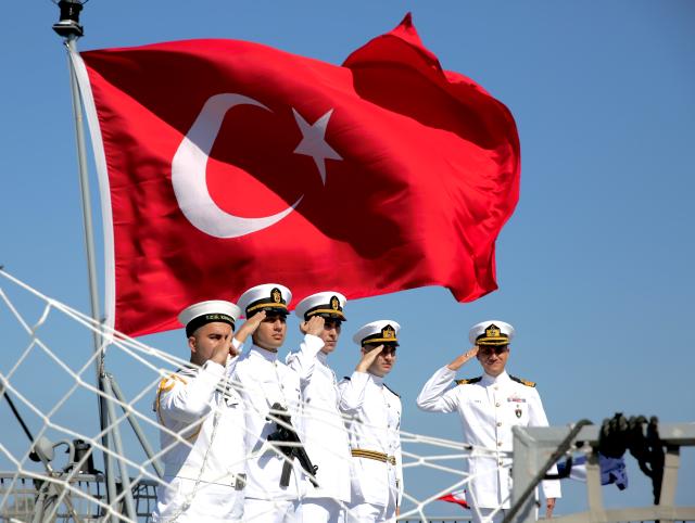 Turkish naval personnel salute in front of the Turkish flag on the Türkiye’s corvette-class warship TCG Kinaliada arriving at Busan Port on June 4 2024 AJU PRESS Han Jun-gu