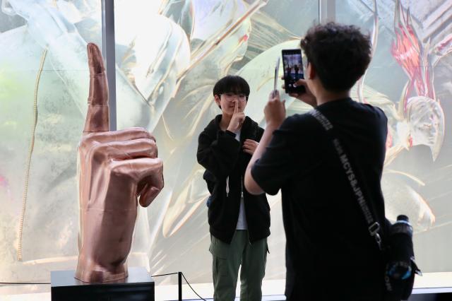 A child mimics Fakers signature shhh pose at the Faker Temple in the HiKR Ground in central Seoul area on June 5th 2024 AJU PRESS Han Jun-gu