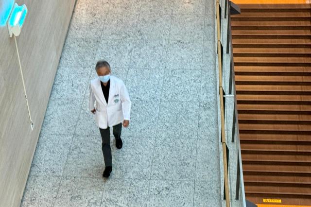 A hospital official walks along a corridor at a university hospital in Seoul South Korea June 5 2024 AJU PRESS Kim Dong-woo