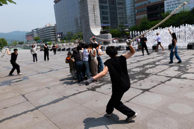 Green Korea United members perform guerrilla street performance Symbiosis expressing animal rights through body movements at Gwanghwamun Square in Jongno Seoul on June 5 2024 AJU PRESS Park Jong-hyeok