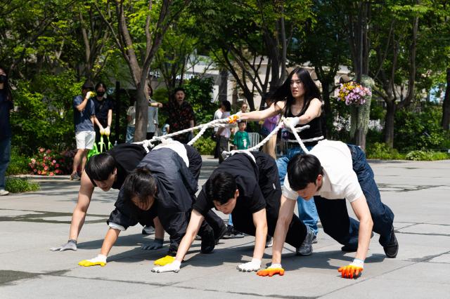 Green Korea United members perform guerrilla street performance Symbiosis expressing animal rights through body movements at Gwanghwamun Square in Jongno Seoul on June 5 2024 AJU PRESS Park Jong-hyeok