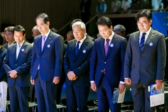 South Korean Prime Minister Han Deok-soo 2nd L and participants observe a moment of silence for the victims of the democracy movement during the 6·10 ceremony at the Seoul Metropolitan Government building in Jung-gu Seoul South Korea June 10 2024 AJU PRESS Kim Dong-woo