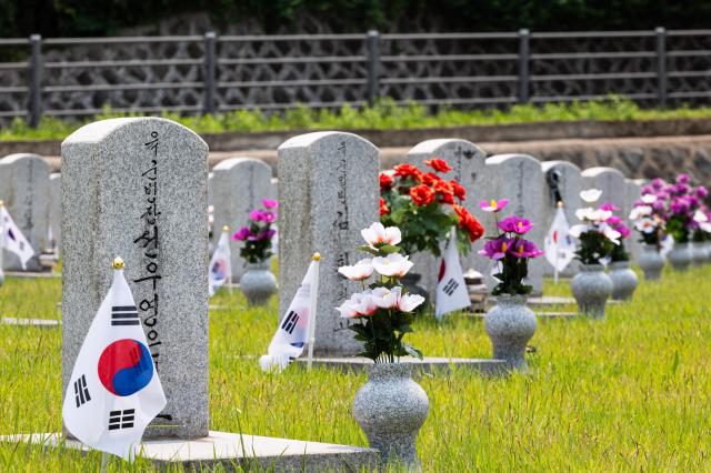 Korean national flags and flowers adorn each gravestone at the Seoul National Cemetery AJU PRESS Park Jong-hyeok