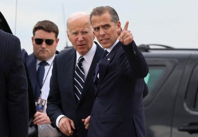 US President Joe Biden stands with his son Hunter Biden who earlier in the day was found guilty on all three counts in his criminal gun charges trial as President Biden arrived at the Delaware Air National Guard Base in New Castle Delaware on June 11 2024 Reuters-Yonhap