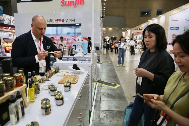 Visitors and participants experience booths from various countries at SEOUL FOOD 2024 held at KINTEX on June 11 2024 AJU PRESS Han Jun-gu