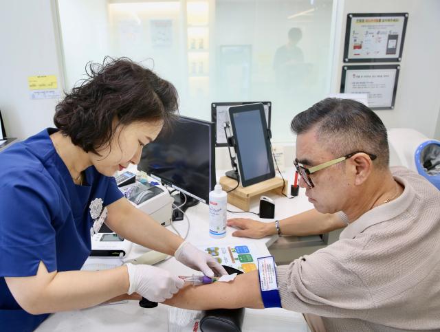 A man gets his blood tested before donating at the Gwanghwamun Blood Donor Center on World Blood Donor Day June 14 2024 AJU PRESS Han Jun-gu