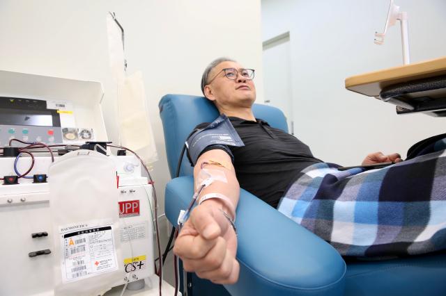 A man donates blood at the Gwanghwamun Blood Donor Center on World Blood Donor Day June 14 2024 AJU PRESS Han Jun-gu