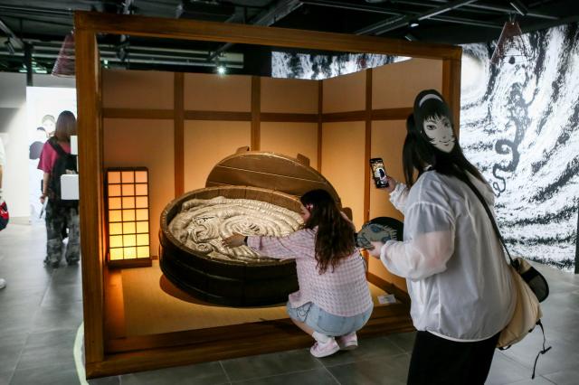 Visitors enjoy the artworks on display at an exhibition in Mapo-gu Seoul June 17 2024 AJU PRESS Kim Dong-woo