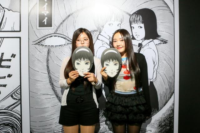 Visitors pose for a photo at the Ito Junji exhibition in Mapo-gu Seoul June 17 2024 AJU PRESS Kim Dong-woo