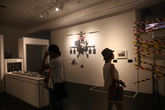 Visitors view the artworks at the REAL BANKSY BANKSY IS NOWHERE exhibition held at The Ground Seoul in central Seoul on June 17 2024 AJU PRESS Han Jun-gu